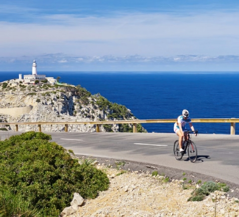 Cyclist riding on Cap de Formentor