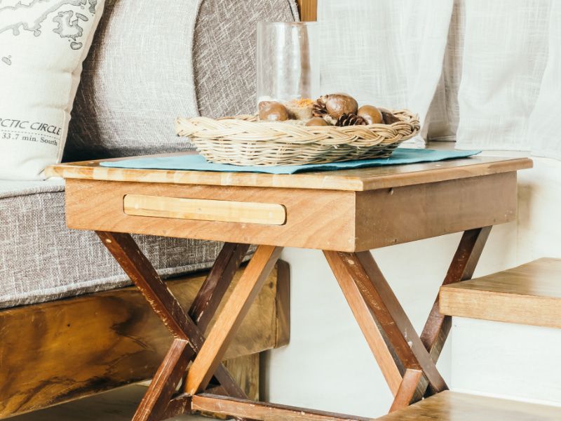 Bedside table decorated with wooden furniture
